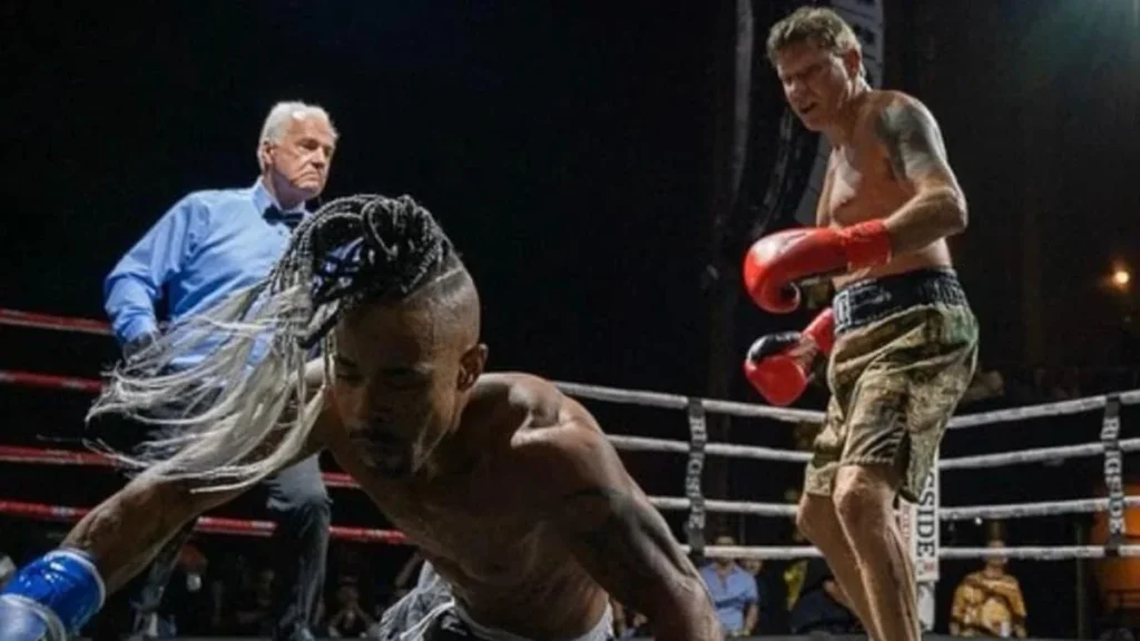 Paul Iannuzzi stands in the ring as his opponent is down during his professional debut.