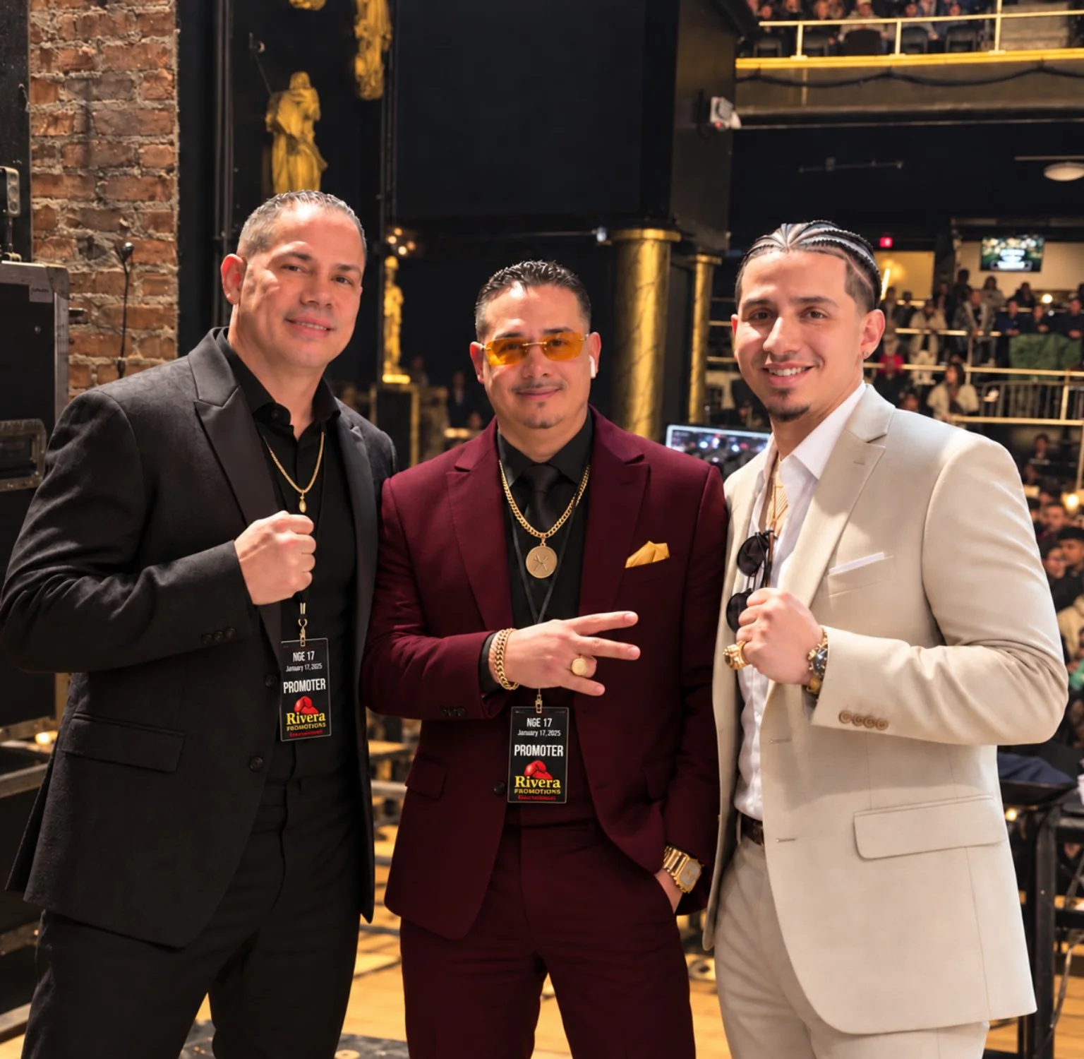 Three Rivera Promotions Entertainment promoters pose at a boxing event wearing promoter credentials.